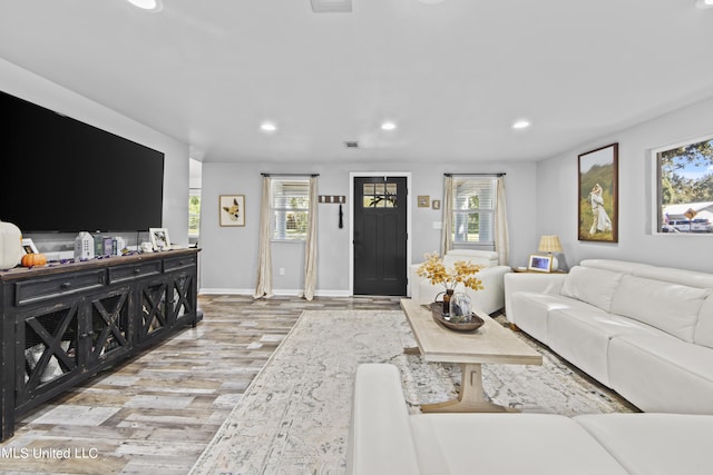 living room with light hardwood / wood-style flooring