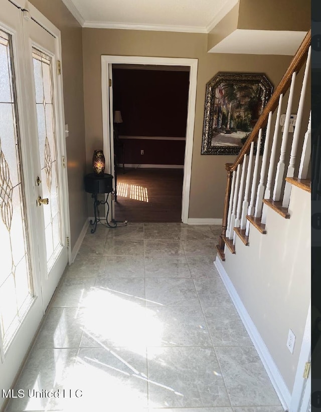 entryway with baseboards, stairs, ornamental molding, and french doors