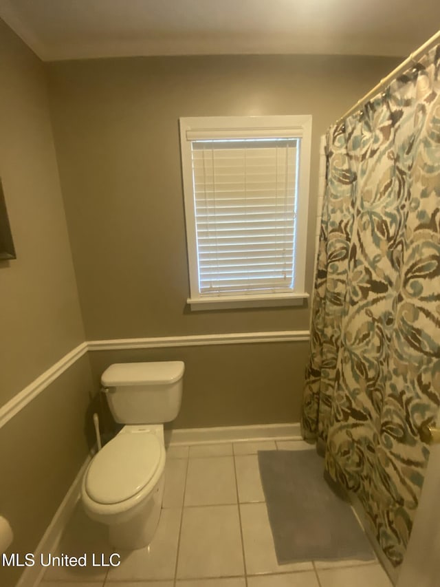 full bath featuring toilet, baseboards, and tile patterned floors