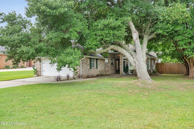 2531 Brighton Cir, Biloxi, MS 39531 - view of property hidden behind natural elements featuring concrete driveway, an attached garage, fence, a front yard, and brick siding