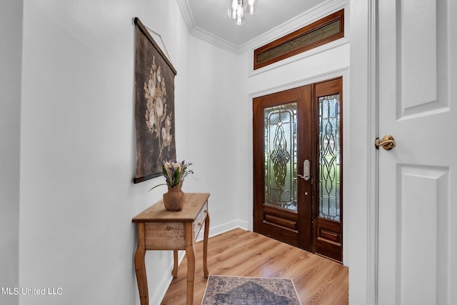 entrance foyer with crown molding and wood-type flooring