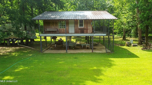 151 Wheatfield Rd, Poplarville, MS 39470 - surrounding community with a patio and a lawn