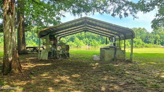 151 Wheatfield Rd, Poplarville, MS 39470 - view of home's community featuring a detached carport, a water view, and a yard