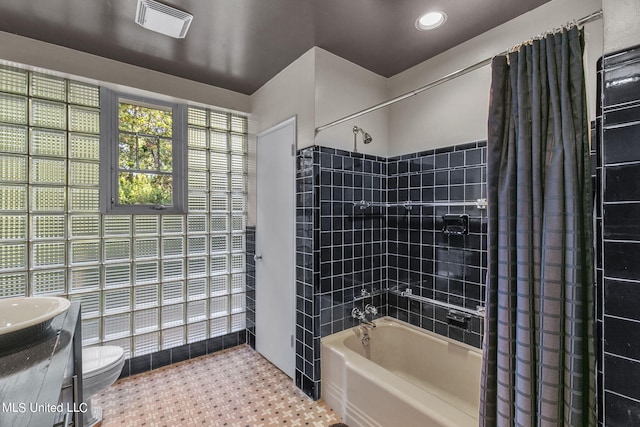 full bathroom with vanity, shower / bath combo, toilet, and tile patterned flooring