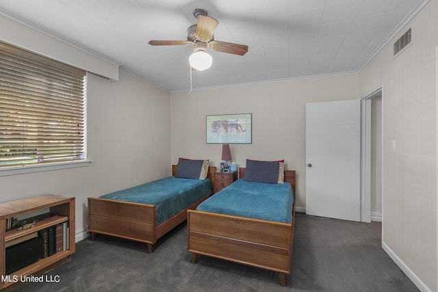 carpeted bedroom featuring crown molding and ceiling fan