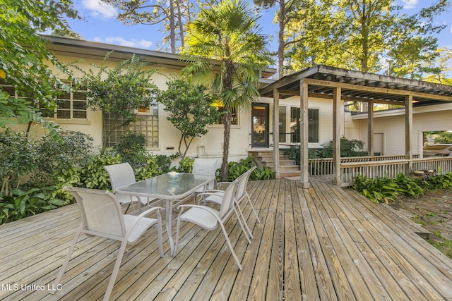 wooden terrace with a pergola