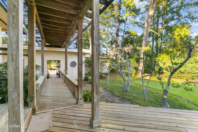 wooden deck featuring a yard