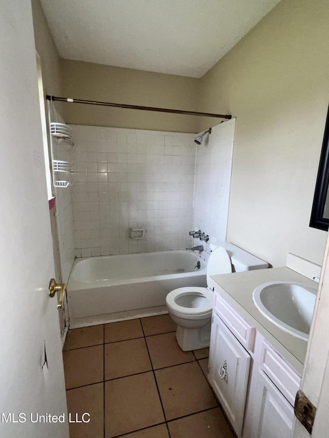 full bath with vanity, tile patterned floors, toilet, and  shower combination