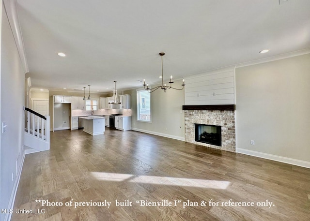 6674 Montclair Ave, Southaven, MS 38672 - unfurnished living room with a chandelier, crown molding, and recessed lighting