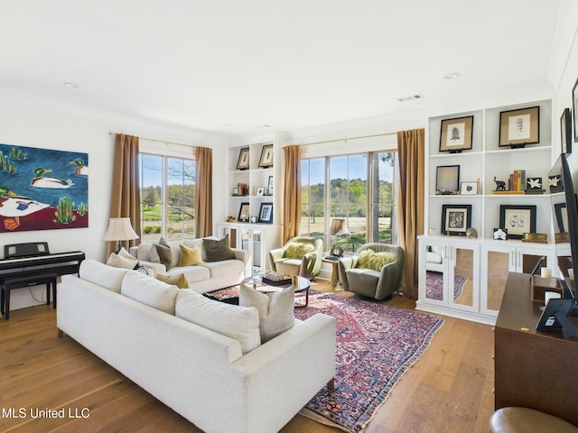 103 Honours Ln, Madison, MS 39110 - living room featuring wood-type flooring, a wealth of natural light, and visible vents