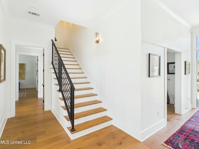 103 Honours Ln, Madison, MS 39110 - staircase featuring ornamental molding, visible vents, baseboards, and wood finished floors