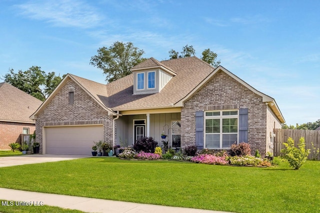2006 Pelican Cir, Long Beach, MS 39560 - traditional-style home with a garage, board and batten siding, driveway, brick siding, and a shingled roof