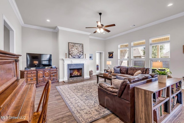 2006 Pelican Cir, Long Beach, MS 39560 - living room with a ceiling fan, a fireplace, wood finished floors, recessed lighting, and crown molding
