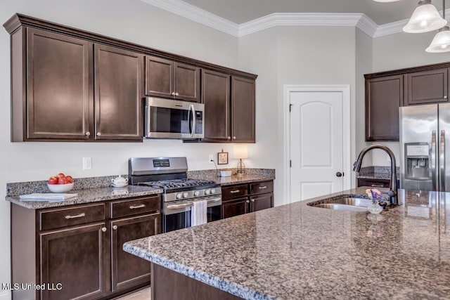 2006 Pelican Cir, Long Beach, MS 39560 - kitchen featuring appliances with stainless steel finishes, a sink, dark brown cabinetry, dark stone countertops, and crown molding