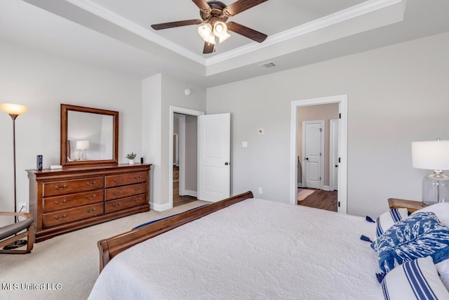 2006 Pelican Cir, Long Beach, MS 39560 - carpeted bedroom featuring a raised ceiling, crown molding, and a ceiling fan
