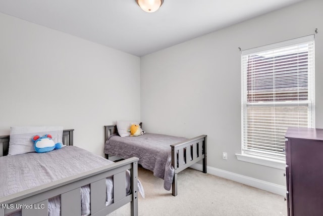 2006 Pelican Cir, Long Beach, MS 39560 - bedroom with light colored carpet, multiple windows, and baseboards