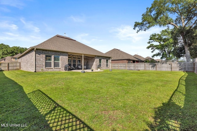 2006 Pelican Cir, Long Beach, MS 39560 - rear view of house featuring brick siding, a shingled roof, and a patio area