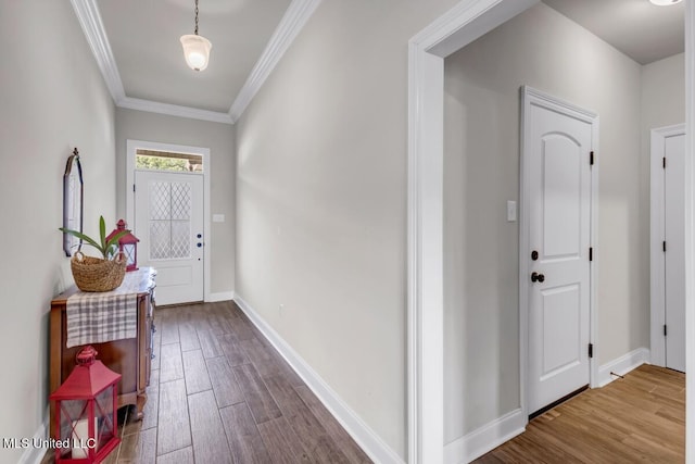 2006 Pelican Cir, Long Beach, MS 39560 - entryway with dark wood-style flooring, crown molding, and baseboards