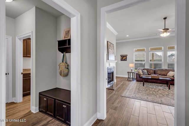 2006 Pelican Cir, Long Beach, MS 39560 - hallway with wood finished floors, baseboards, and ornamental molding