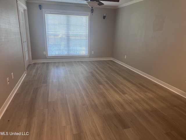903 Westwood St, Pascagoula, MS 39567 - unfurnished room with baseboards, ornamental molding, ceiling fan, and wood finished floors