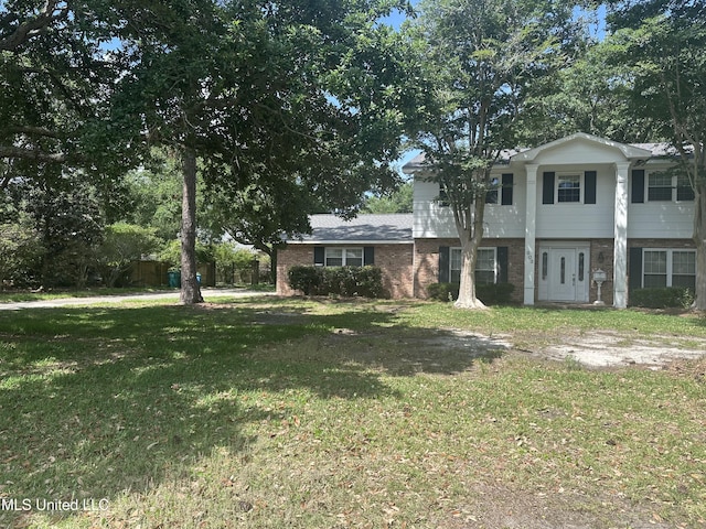 903 Westwood St, Pascagoula, MS 39567 - colonial house with brick siding and a front lawn