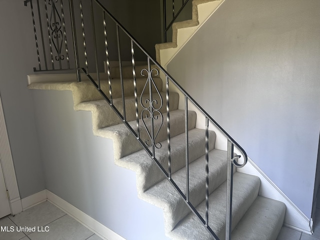 903 Westwood St, Pascagoula, MS 39567 - staircase featuring baseboards and tile patterned floors