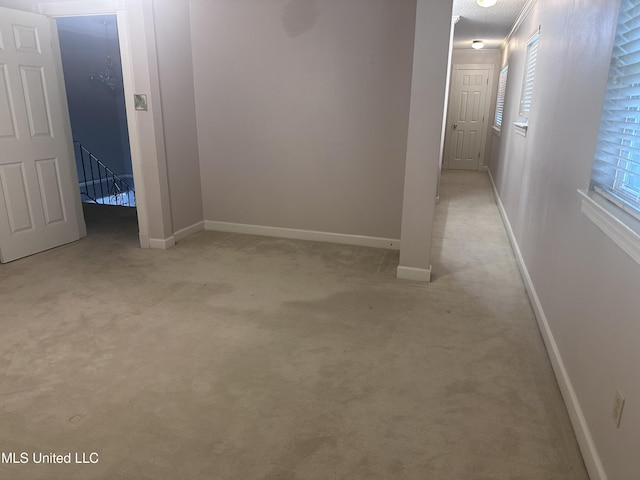 903 Westwood St, Pascagoula, MS 39567 - corridor with baseboards, an upstairs landing, and light carpet