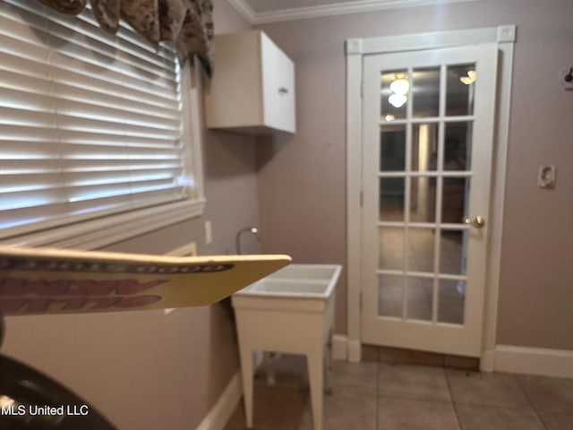 903 Westwood St, Pascagoula, MS 39567 - tiled dining room featuring crown molding and baseboards
