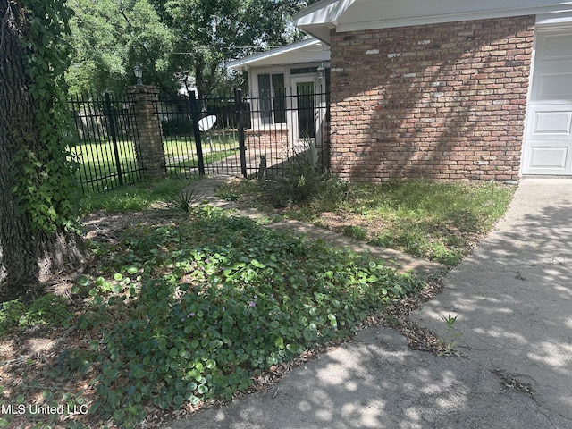 903 Westwood St, Pascagoula, MS 39567 - view of property exterior featuring brick siding and fence