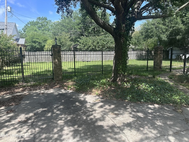 903 Westwood St, Pascagoula, MS 39567 - view of gate featuring fence and a yard