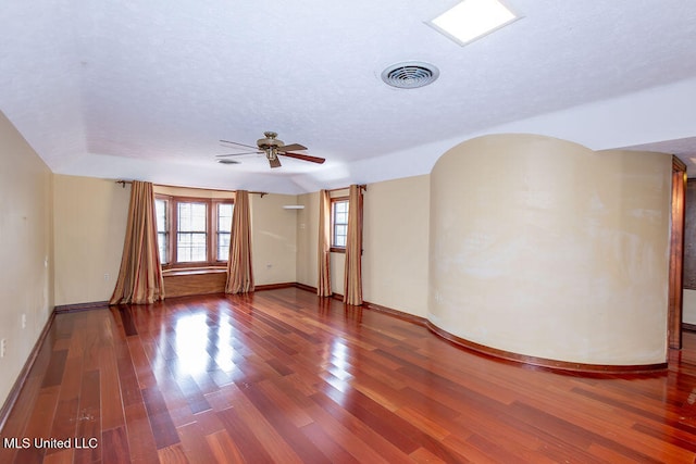 spare room with ceiling fan and hardwood / wood-style floors