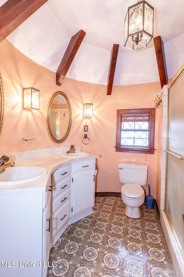 bathroom with vanity, toilet, a shower with shower door, and vaulted ceiling with beams