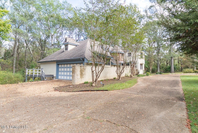 view of side of home with a garage