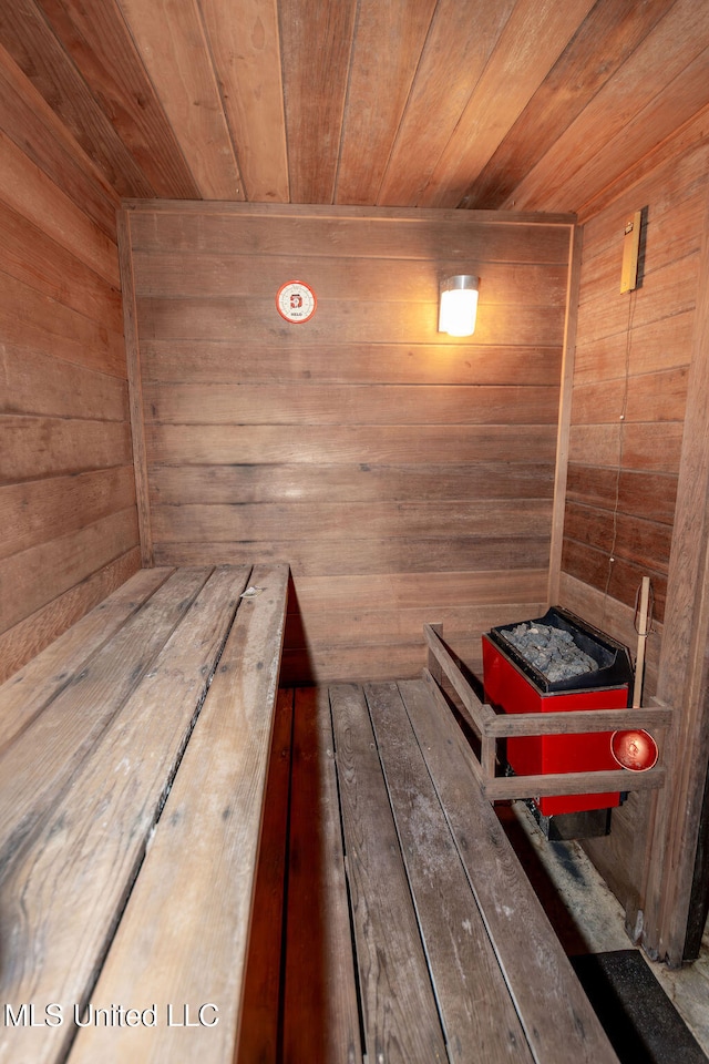 view of sauna / steam room with wood ceiling and wood walls