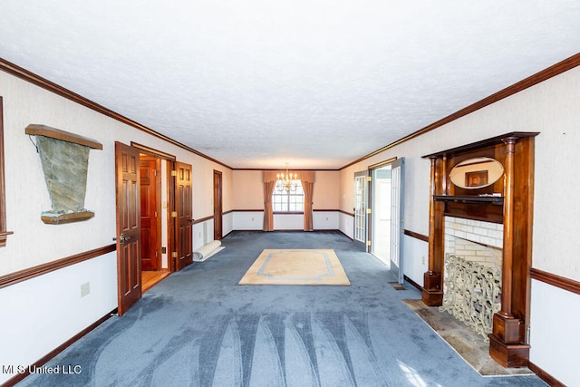 corridor with an inviting chandelier, a textured ceiling, dark carpet, and crown molding