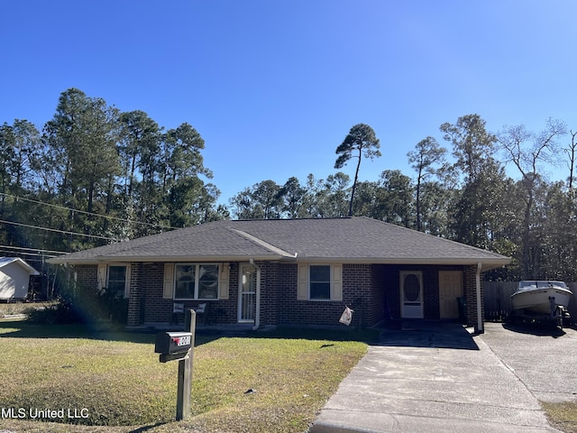 single story home featuring a front yard and a carport