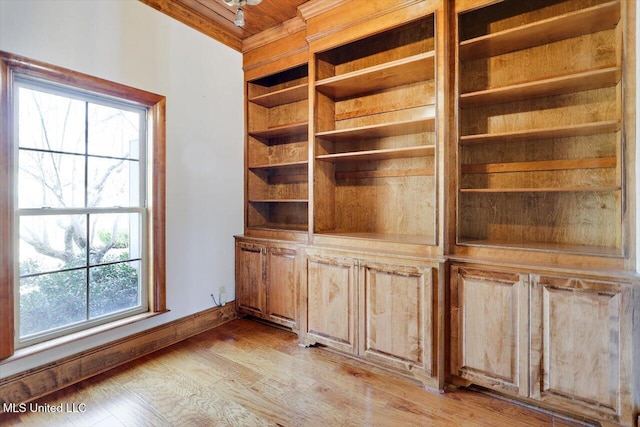 details featuring wood finished floors and baseboards