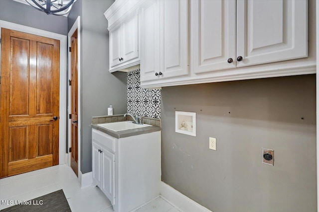 laundry room featuring light tile patterned floors, hookup for a washing machine, cabinet space, electric dryer hookup, and a sink