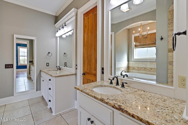 bathroom with crown molding, two vanities, a healthy amount of sunlight, and a sink