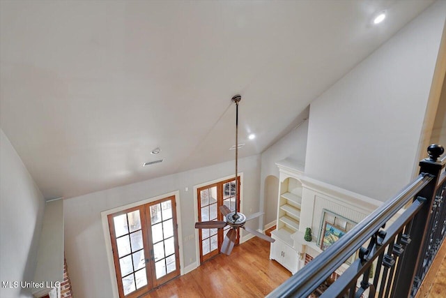 room details featuring visible vents, wood finished floors, recessed lighting, french doors, and baseboards