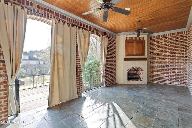 interior space with ceiling fan