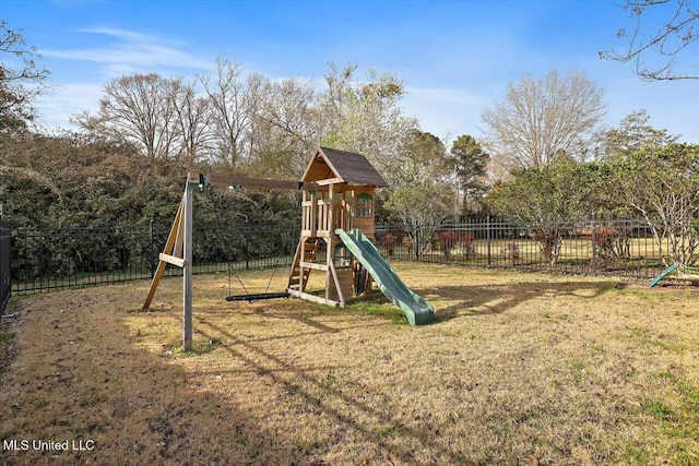 view of play area with a lawn and fence