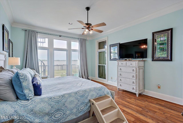 bedroom featuring crown molding, wood-type flooring, and ceiling fan