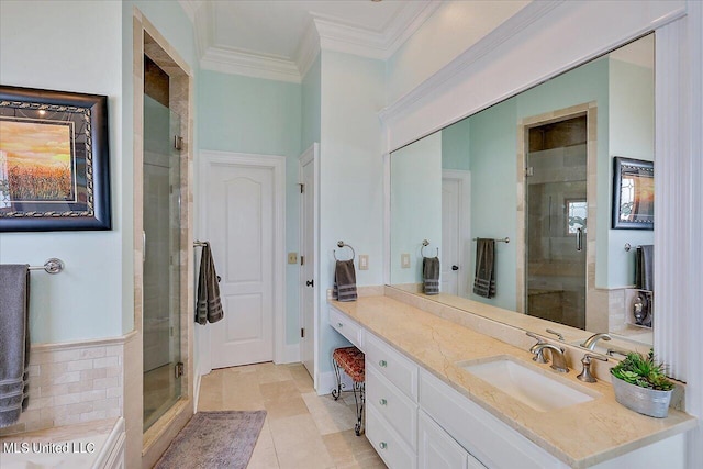 bathroom with vanity, crown molding, a shower with shower door, and tile patterned flooring