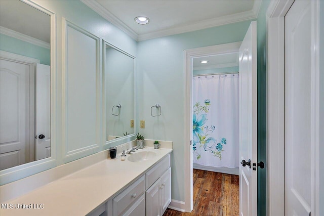 bathroom with vanity, hardwood / wood-style floors, a shower with curtain, and ornamental molding