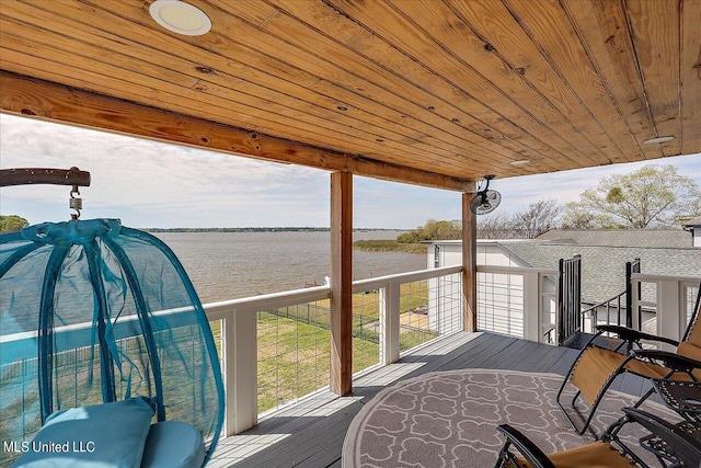 wooden deck featuring a water view