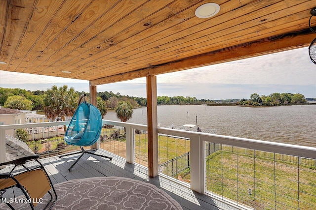 deck featuring a water view and a yard