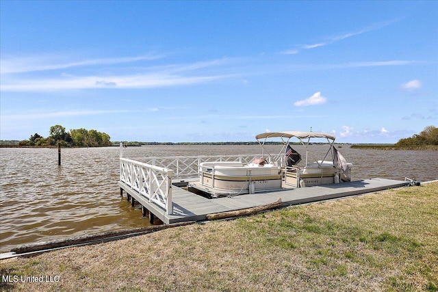 view of dock with a water view and a lawn