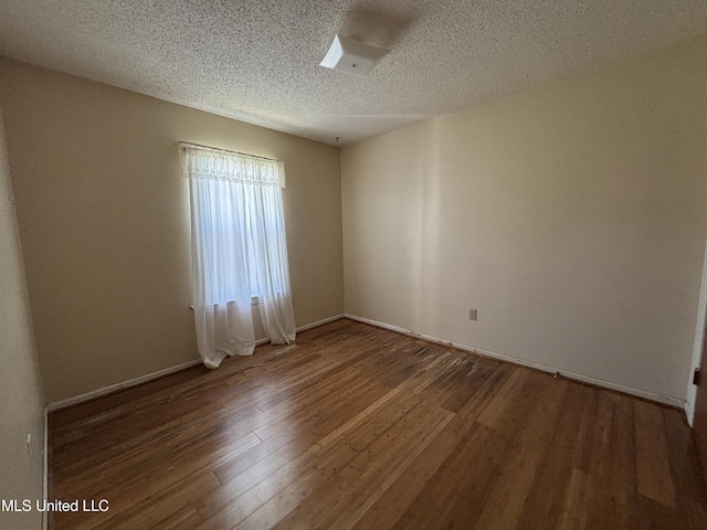 126 Faust Dr, Gulfport, MS 39503 - spare room featuring wood finished floors, a textured ceiling, and baseboards
