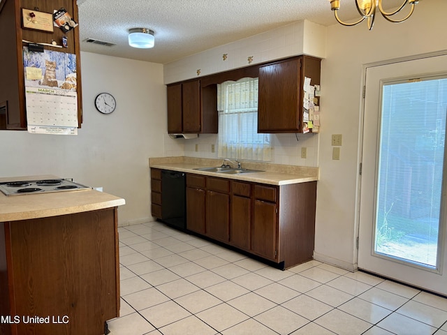 126 Faust Dr, Gulfport, MS 39503 - kitchen featuring black dishwasher, a sink, light countertops, stovetop, and a textured ceiling